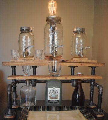 A tabletop beverage dispenser ready to serve 3 different beverages with removable easy to clean jars.