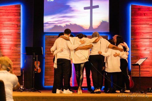 Calvary Chapel worship team praying before service starts.