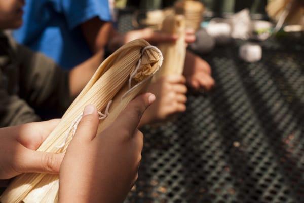 Students were given the opportunity to learn about history by hearing stories and making corn husk dolls.