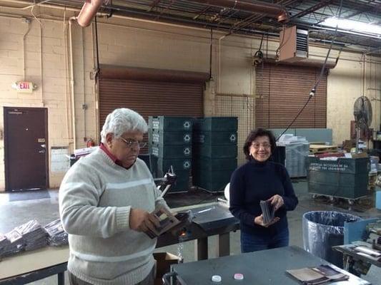 Nelson Fuentes Sr and Yolanda hand packing brochures for a rush job