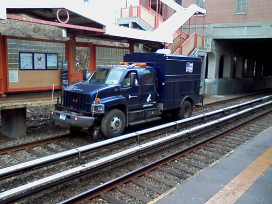 Specialized truck does maintenance on Staten Island Railway.