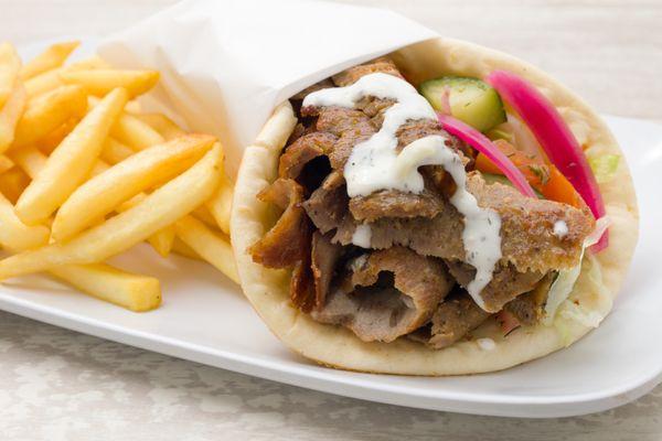 Fresh carved gyro meat with tzatziki sauce and side of fires. You can't beat that!