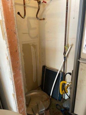 This shows the original water heater, then after it & the door frame were removed to make the new one fit.