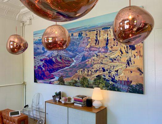 Condiment bar, beneath a painting of the Grand Canyon.