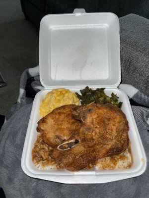 Fried Pork Chop, macaroni, and greens.