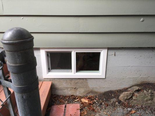 Basement vinyl replacement window.