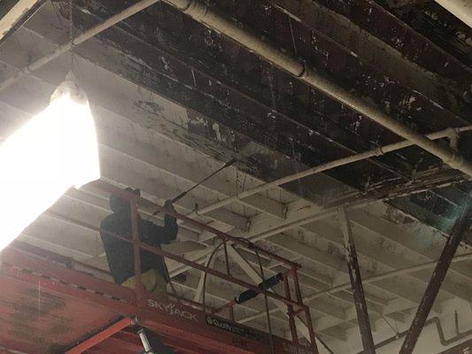 Hertz Car Rental, paint removal from inside warehouse ceilings