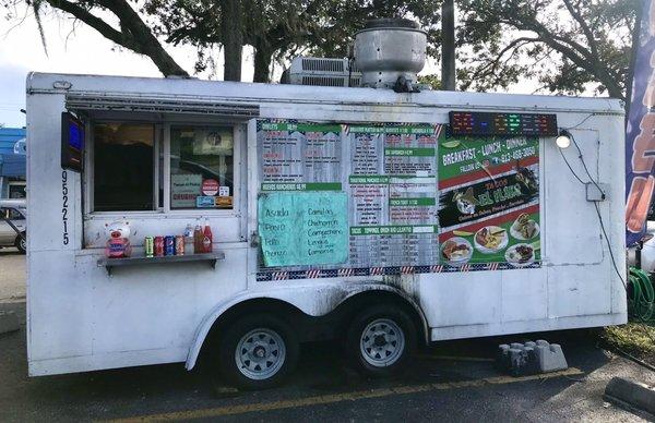 Food truck with menu on side.