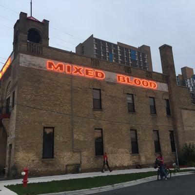 Mixed Blood Theatre with "Ghetto in the Sky" behind it