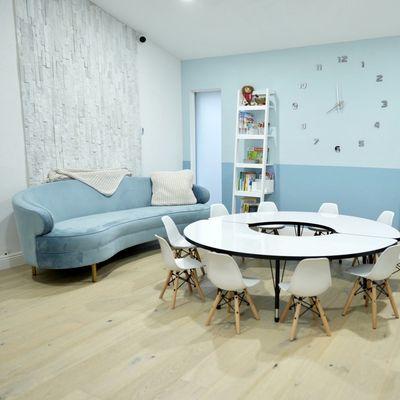 A cozy room for learning and nourishment at Mini Bambini