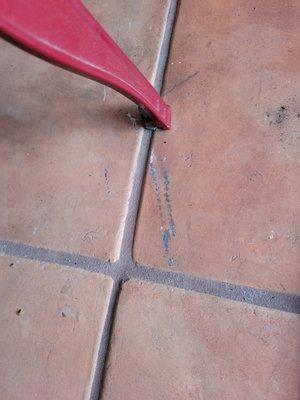 gashes left in floor tiles