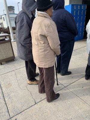 Elderly couple Standing outside for over an hour in 20 degree weather. absolutely ridiculous