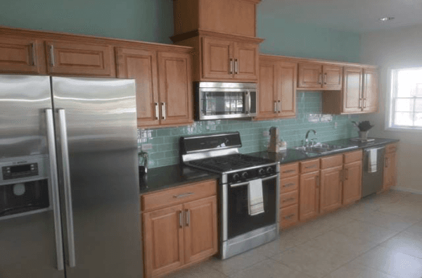 Oak face-framed kitchen cabinets with granite tops