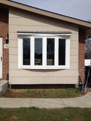 Fabricate and install picture window with bump out