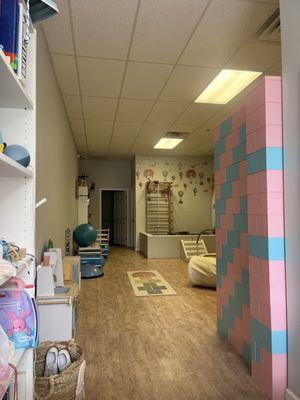 Playroom area with foam pit, trampoline , wall climb and more