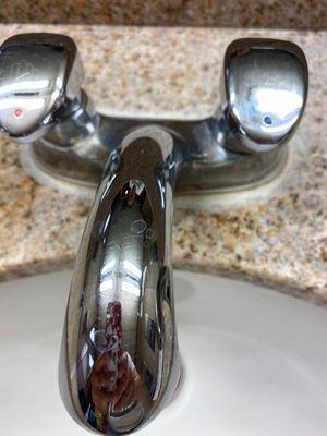 Hard-water/calcium removal on sink.