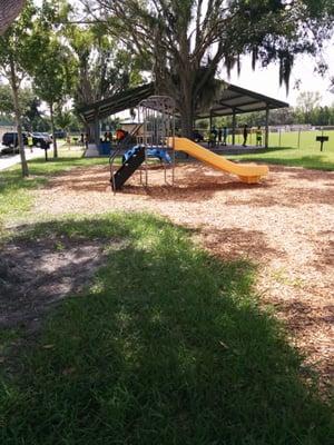 Tiny toddler playground by the dog park.