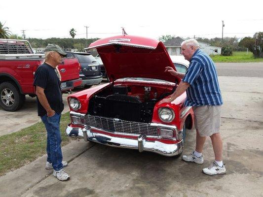 Founder of John's Transmissions and Engine Mr. John Pollard talking shop with a good customer of ours John Ivey.