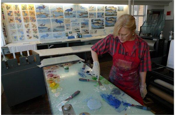 Artist-in-Residence, Susan Amons, creating monoprints in WSW's printmaking studio.