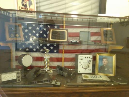 Display case of old school Po Po stuff.