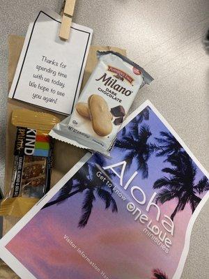 Thank you for the new visitor welcome package. Church info brochure and snacks.