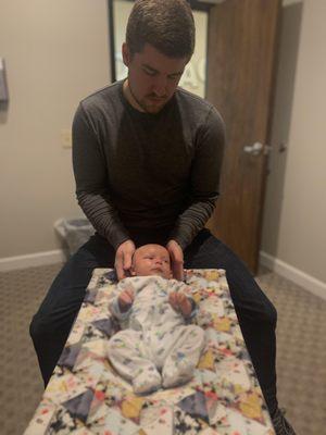 Chiropractic is for all ages! One-month-old being adjusted by Dr. Frederick