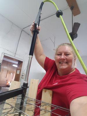 Heather stapling the spring down for our box spring.