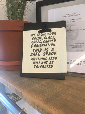 Sign up front: "We value your color, class, creed, gender, and orientation. This is a safe space. Anything less will not be tolerated."