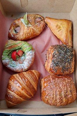 Variety of pastries; from top left ham n chs croissant, curry puff, spam n kimchi, pan au choco, reg, and matcha