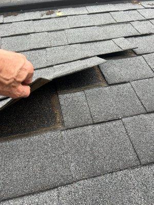 inspecting dimensional shingle gray roof