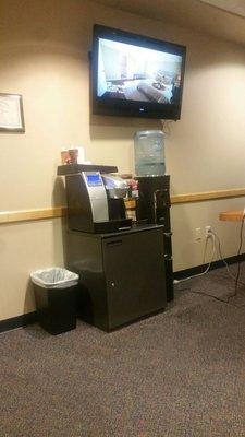 Keurig machine and bottled water while you wait.