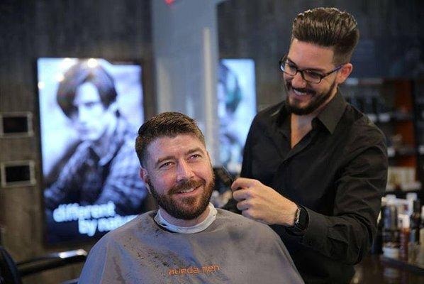 Barber Jared and guest at Aveda Men, a premier barbershop in downtown St. Petersburg, FL.