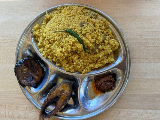 Kichuri (lentil rice) with fish and fried eggplant