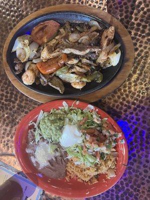 Trio Fajitas Shrimp, Steak and Chicken with sautéed vegetables