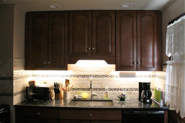 The LED lighting below the new cabinets.