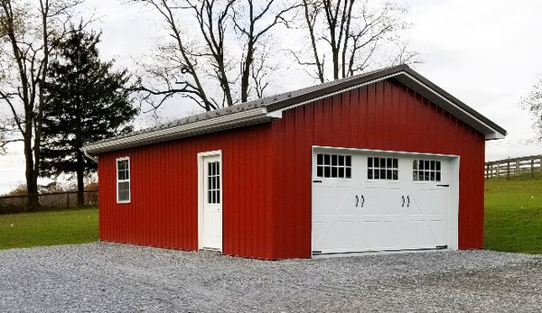 One-car garage built in 2017 in PA. Burnished Slate roof, Red siding, Bright White trim, snow guards, and carriage style doors.