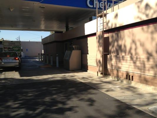 The open area near the ice machine and ladder is not a parking space.