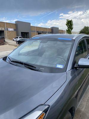 Windshield being replaced