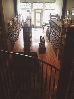 Spiral staircase leads up to the teen/young adult, sci-fi, and comic sections in the loft.