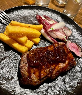 10oz NY Strip Steak - delicious!  polenta fries, charred onion jus, endive salad Sides