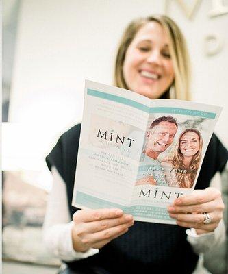 A team member looking at a pamphlet.