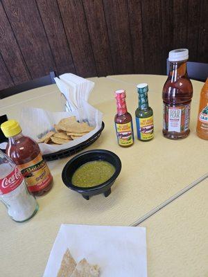 Variety of hot sauces, complimentary chips and green salsa when dining in. The salsa is not spicy, very flavorful.