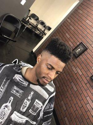 High top fade : free hand top / bald fade on sides / edge up