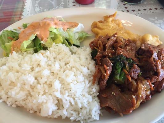 Korean spicy pork. Yes it comes with a piece of fish and a salad. Enough for two to share.