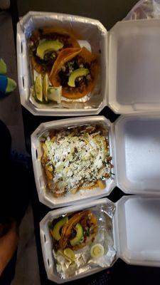 Pastor and barbacoa tacos, Asada fries, and two pastor tacos.