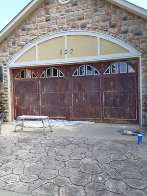 before image of a garage door that was sanded down and restained