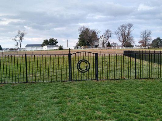 Custom Gate. 2 Rail Aluminum fence installed by Pierce Fence