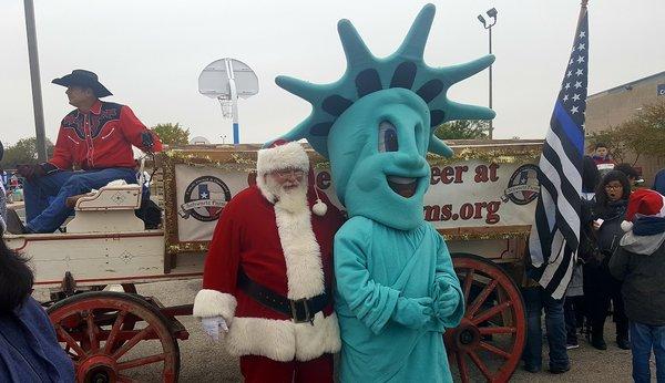 Blue Santa Parade with Liberty Tax Service