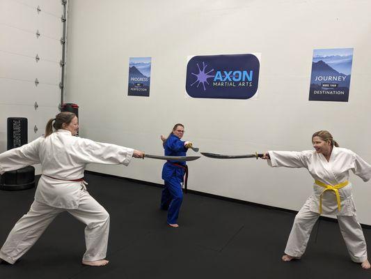 Weapons training is part of the curriculum at Axon Martial Arts: broadsword, bo staff, nun-chucks, escrima just to name a few.