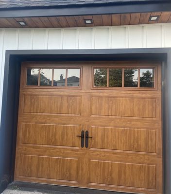 Our new garage door that matches the stained cedar soffit.